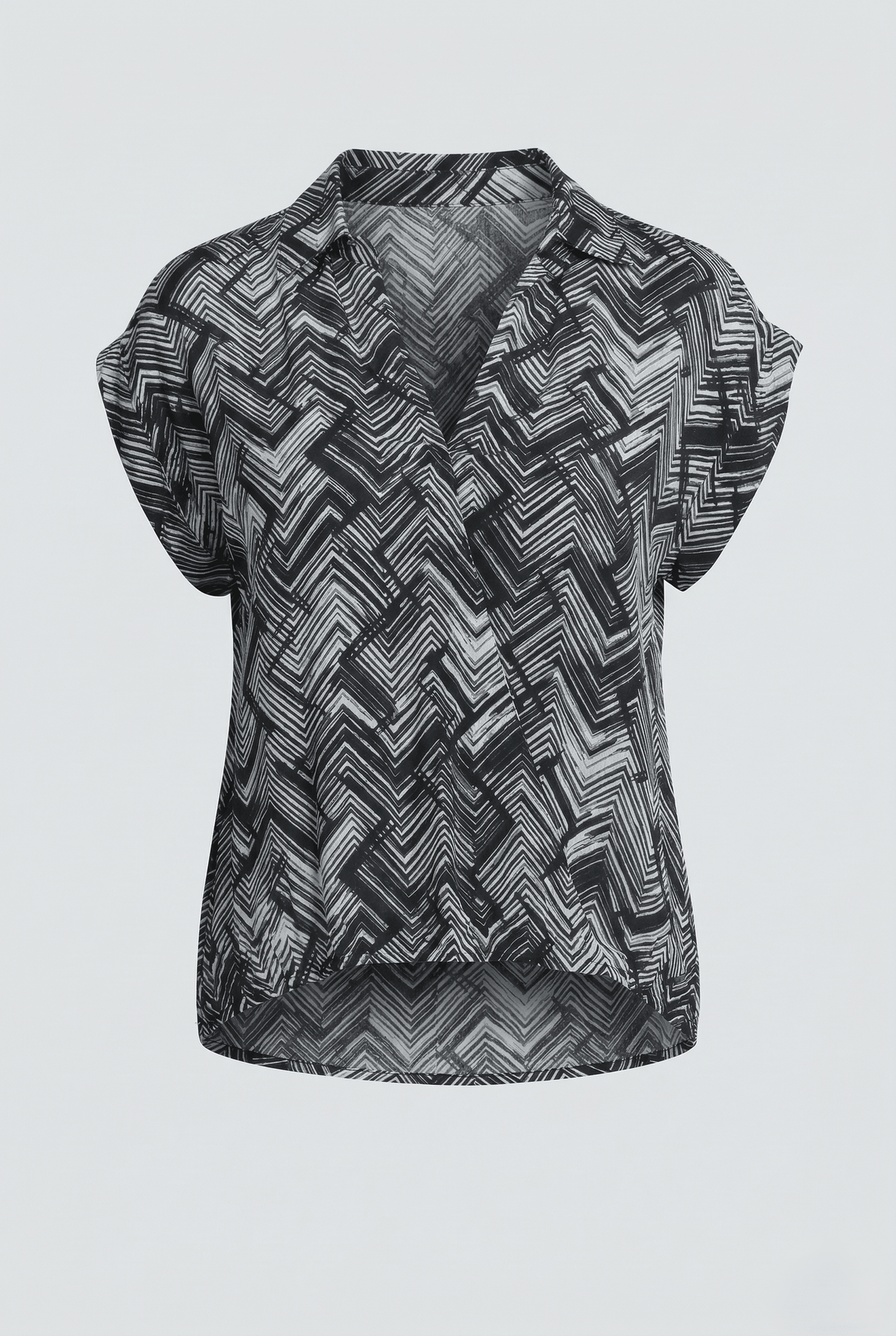 Black and white patterned sleeveless top on a light gray background