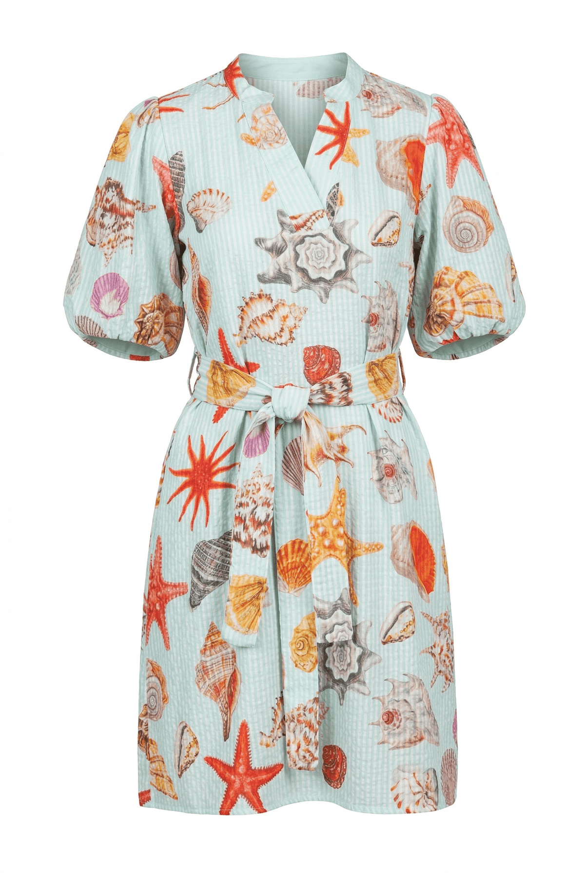 Floral and shell patterned dress on a white background