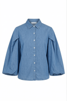 Blue denim shirt on a white background
