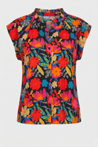 Colorful floral patterned shirt on a white background