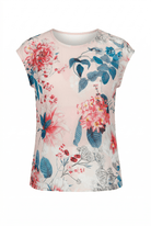 Floral sleeveless top with colorful flowers and leaves on a white background