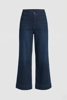 Dark blue jeans on a light gray background