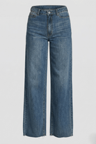 Blue jeans on a light gray background