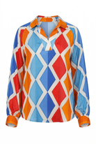 Colorful geometric patterned shirt on a white background
