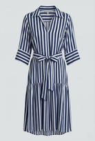Navy and white striped dress with a belt on a light gray background