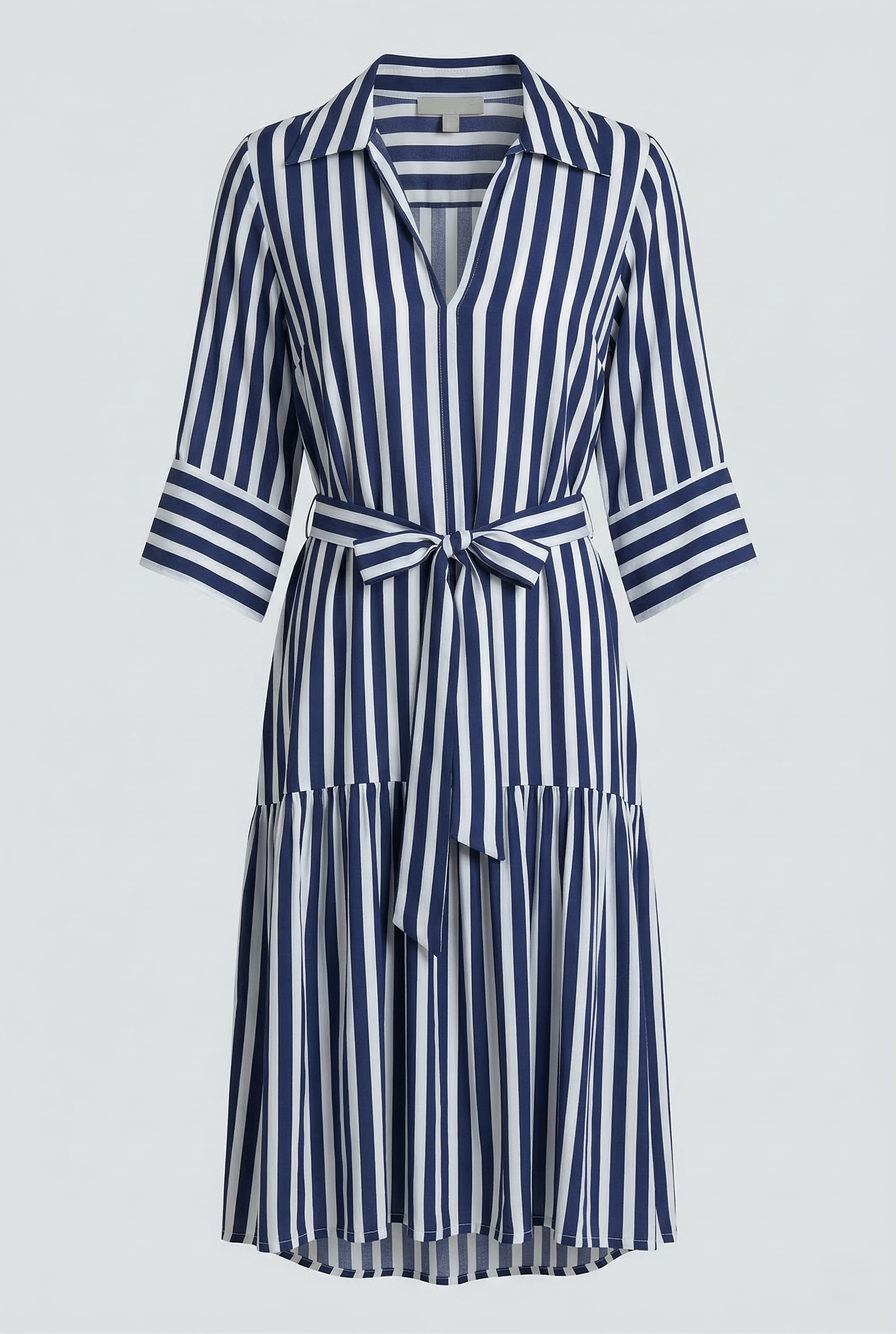 Navy and white striped dress with a belt on a light gray background