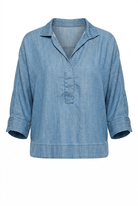 Blue denim shirt on a white background