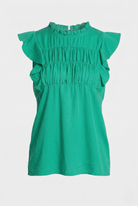 Green top with ruffled sleeves on a light gray background