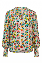 Colorful patterned blouse on a white background