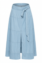 Light blue wrap skirt with a tie waist on a white background