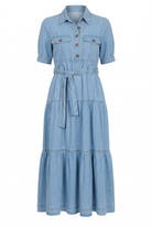 Blue denim dress with a belt on a white background