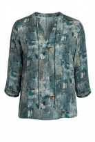 Blue abstract patterned shirt on a white background