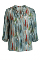 Multicolored patterned blouse on a white background